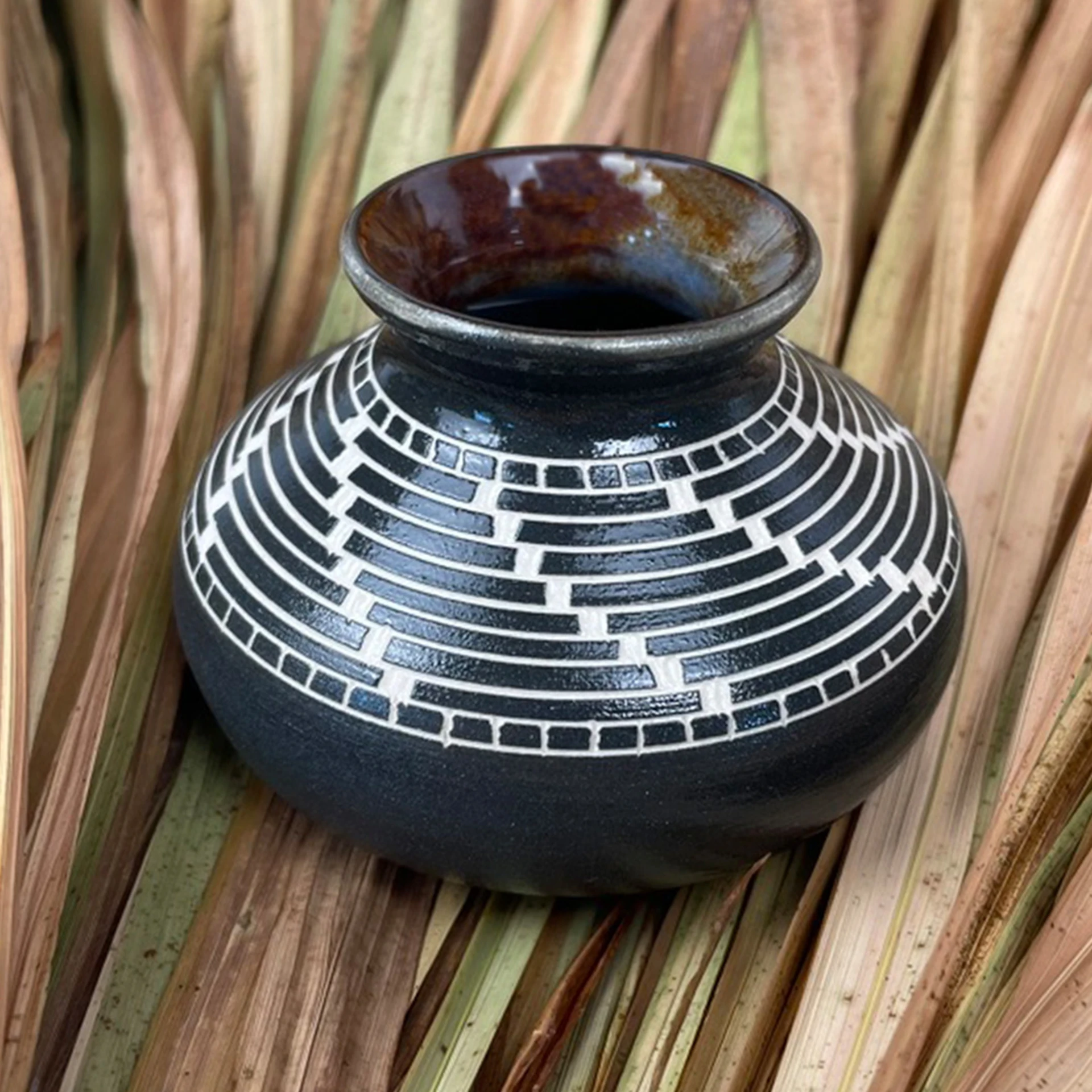 1.edgelands-reel-photo-1._patrick_leach__basket_weave__2024___hand_carved_ceramic_vase.jpg